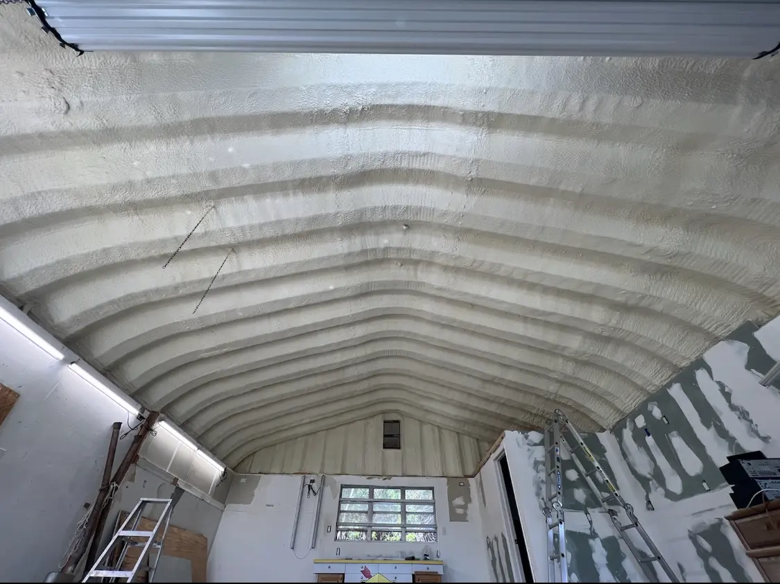 Spray polyurethane foam applied to the underside of a metal roof deck in Alamogordo